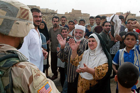 U.S. Army soldiers warmly welcomed by residents of Baghdad, April 9, 2003.